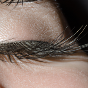 A close up of a pair of eyelashes with a subtle magnetic force field effect around them.