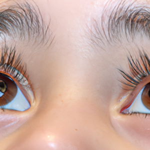 A close-up of a pair of eyes with long, thick eyelashes.