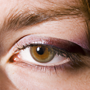 Close-up of a woman's eye, with smudged mascara underneath.