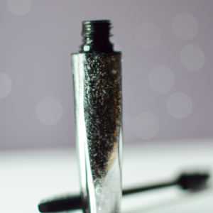 A tube of mascara with a sparkly, glossy finish.