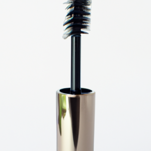 A close-up of a tube of mascara, with a soft, feathery brush emerging from the top.