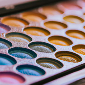 A close-up of a colorful eyeshadow palette, with a variety of shades and textures.