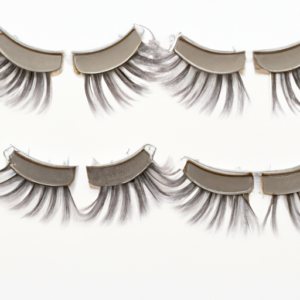 A close-up of a set of magnetic eyelashes on a white background.