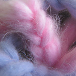 Suggestion: A close-up of soft, cotton-like fibers in different shades of pink, purple, and blue.