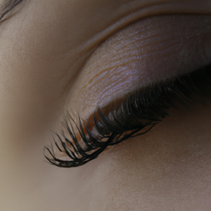 Close-up of a pair of eyelashes, with a subtle hint of mascara.